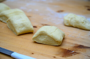 Kneaded flour, cut on a wooden board