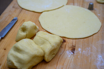 Kneaded flour, cut on a wooden board
