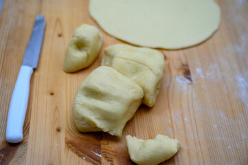 Kneaded flour, cut on a wooden board