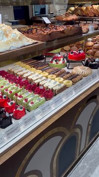 Delicious Delights: French Pastries Displayed in a Parisian Food Hall