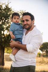 Fototapeta premium Father Holding Son on Father's Day