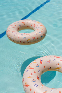 Two pool floaties in the pool