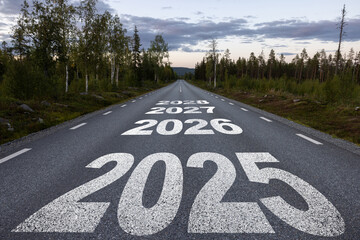 New year 2025 or straight forward concept. Text 2025, 2026, 2027, 2028 written on the road in the...