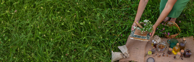 woman and herbal tinctures, tea, medicinal herbs.