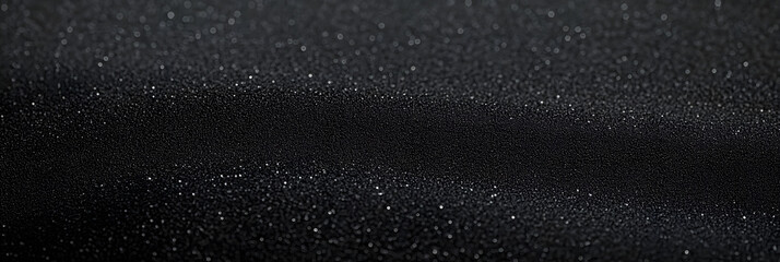 black sandpaper texture background close up