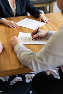 Signing Real Estate Contract at Meeting