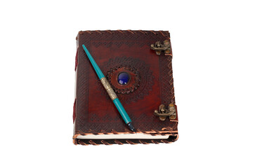 antique notebook or diary in leather or leather with carving and blue stone, silver metal clasp, green and gold wooden pen, white or transparent background, horizontal foreground photo with space for 