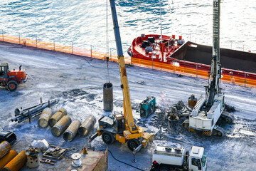 Installation of pile casings in the port quay, drilling rig, port infrastructure upgrade works