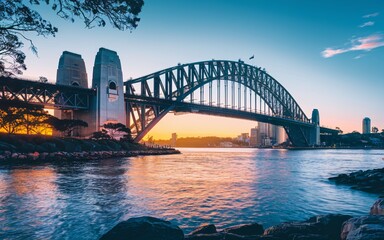 Obraz premium Harbour Bridge Sunset Silhouette: Dramatic Sydney Skyline Background