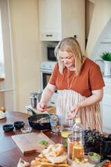 Woman Cook Housewife Cooks Delicious Dinner For Family