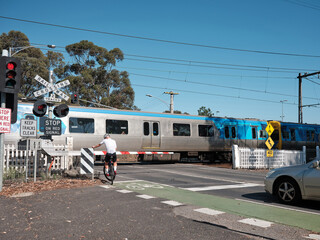 Cyclist Crossing Railway Crossing in Melbourne