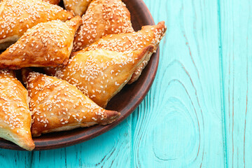 Homemade triangle puff pastry with meat on rustic background . Samosa