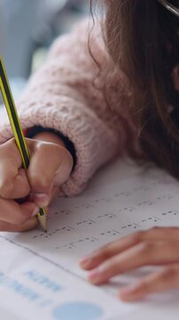 Child, learning or hands writing math answers or numbers for education, development or school. Mathematics, closeup and kid student in classroom for academic work, studying or numeracy activity paper