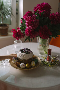 Festive Easter table with bouquet of peonies