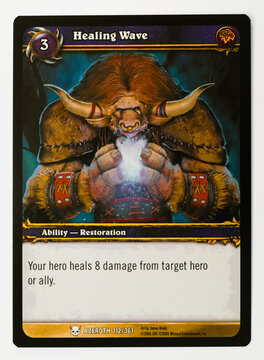 Hamburg, Germany - 06192024: photo of English World of Warcraft trading game card called Healing Wave from the heroes of azeroth set on white paper background.