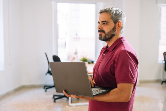 Businessman working on laptop in office