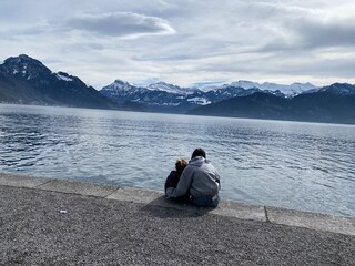 Fototapeta premium man sitting on a lake