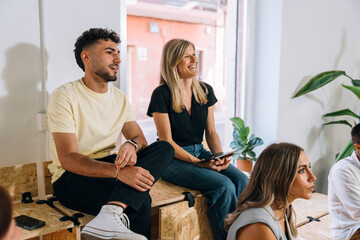 Happy employees attending training session