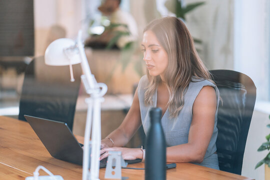Woman in office with laptop