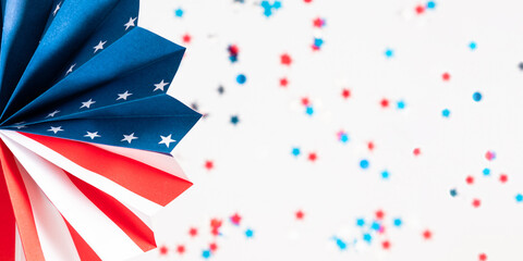 Obraz premium 4th of July, USA Presidents Day, Independence Day, Memorial day, US election concept. Red white and blue paper fans with stars confetti on white background. Flat lay, top view, copy space, banner