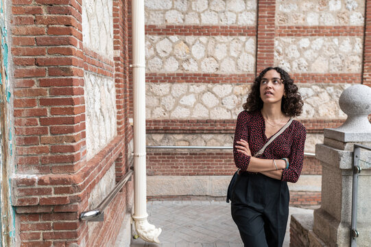 Woman student walking through university campus