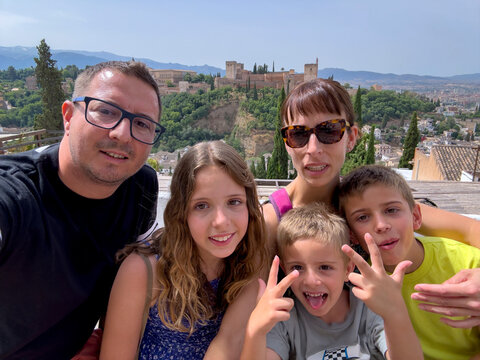 A simpatic family selfie on vacation - Powered by Adobe