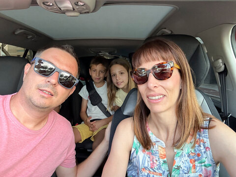 Selfie of a family on a road trip