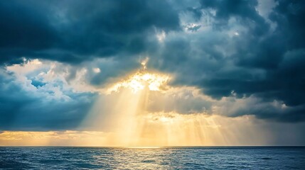 Sun rays breaking through dark storm clouds over the ocean, dramatic weather, hope after the storm