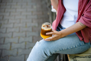 A woman drinks a cocktail