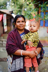 Fototapeta premium South asian rural grandmother with her grandson 