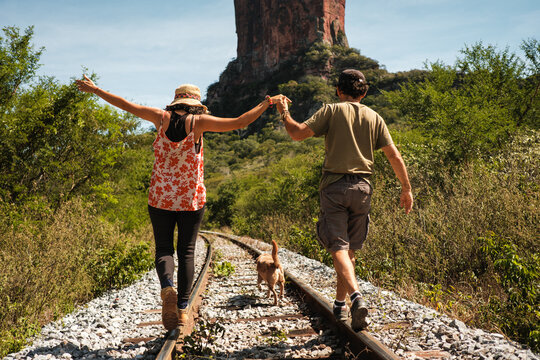 retired couple, enjoying their retirement traveling with their dog
