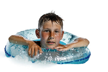 Young boy swimming with a colorful tube in a pool