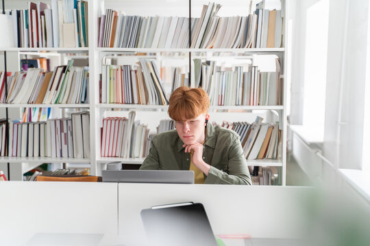 Student using laptop at library