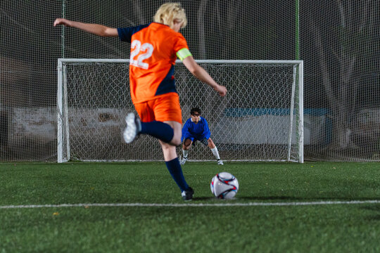 Football player kicking a penalty kick.