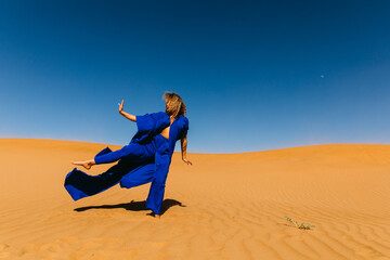 Woman in Blue Posing in the Sahara Desert