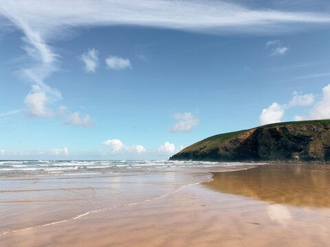 Reflections and blue sky at Mawgan Porth beach