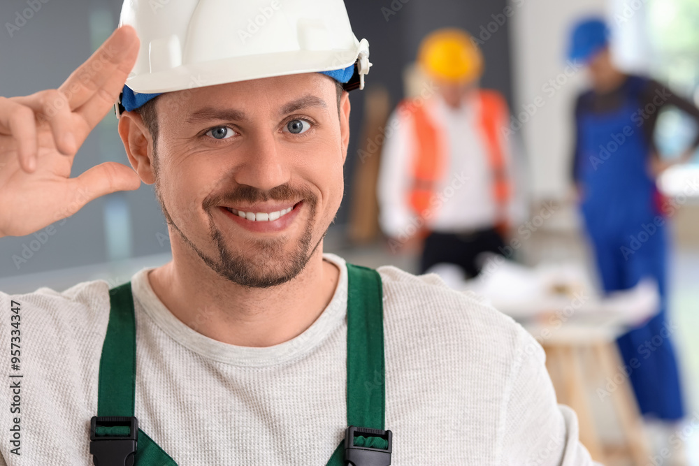 Sticker Male builder working in room, closeup