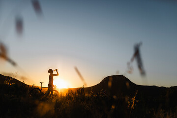 Silhouettes of cyclists at sunset