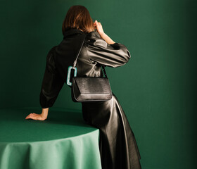 Fashionable Woman in Black Leather Jacket with Stylish Handbag