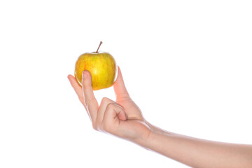 Man child hand holding green apple, isolated on white background. Girl hand holding green apple isolated on white background. Healthy eating and diet topic, human hand holding apple