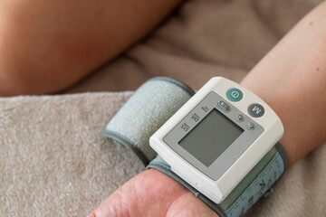 Close up shot of a wrist blood pressure monitor, tonometer. Healthcare