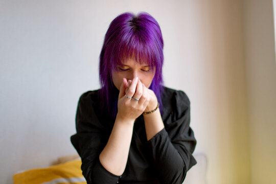 portrait of a woman with purple hair holds a tea ceremony