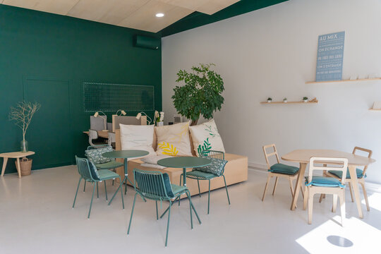 Spacious Modern Office Workspace with Green Decor
