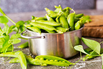 Green peas in metal bowl