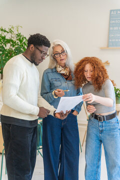 Diverse Business Group Review of Documents In The Office.