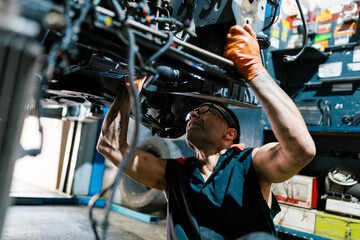 Mechanic Fixing Undercarriage