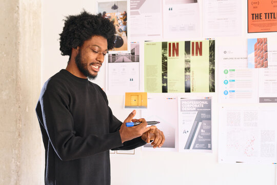 Businessman Leading Meeting explaining something to his team.