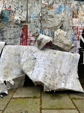 wall with torn posters
