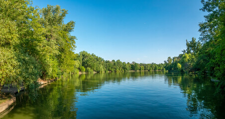 Fototapeta premium The Colentina river flowing into lake Herestrau, Michael I Park, Bucharest, Romania