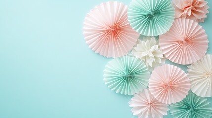 Obraz premium Soft pastel pink and mint ornaments are elegantly arranged against a light blue backdrop, enhancing a tranquil and festive holiday ambiance